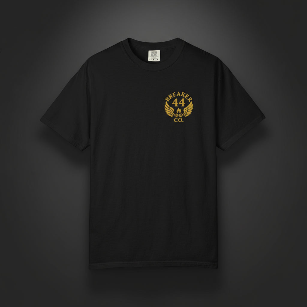 Black t-shirt with yellow logo on a dark studio background