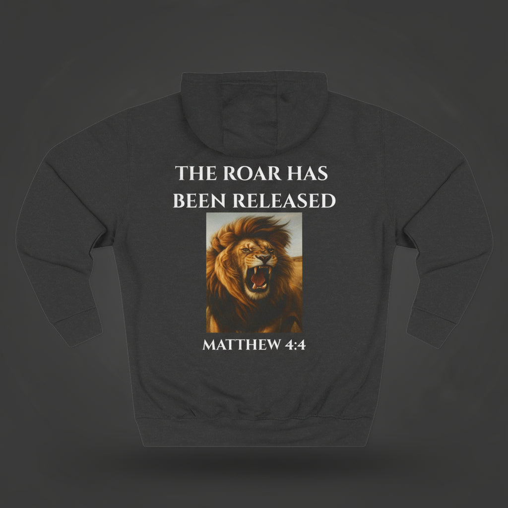 Black hoodie with a lion graphic and text on a dark studio lit background