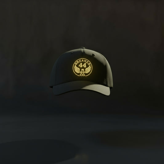 Black cap with gold logo and text on a white background
